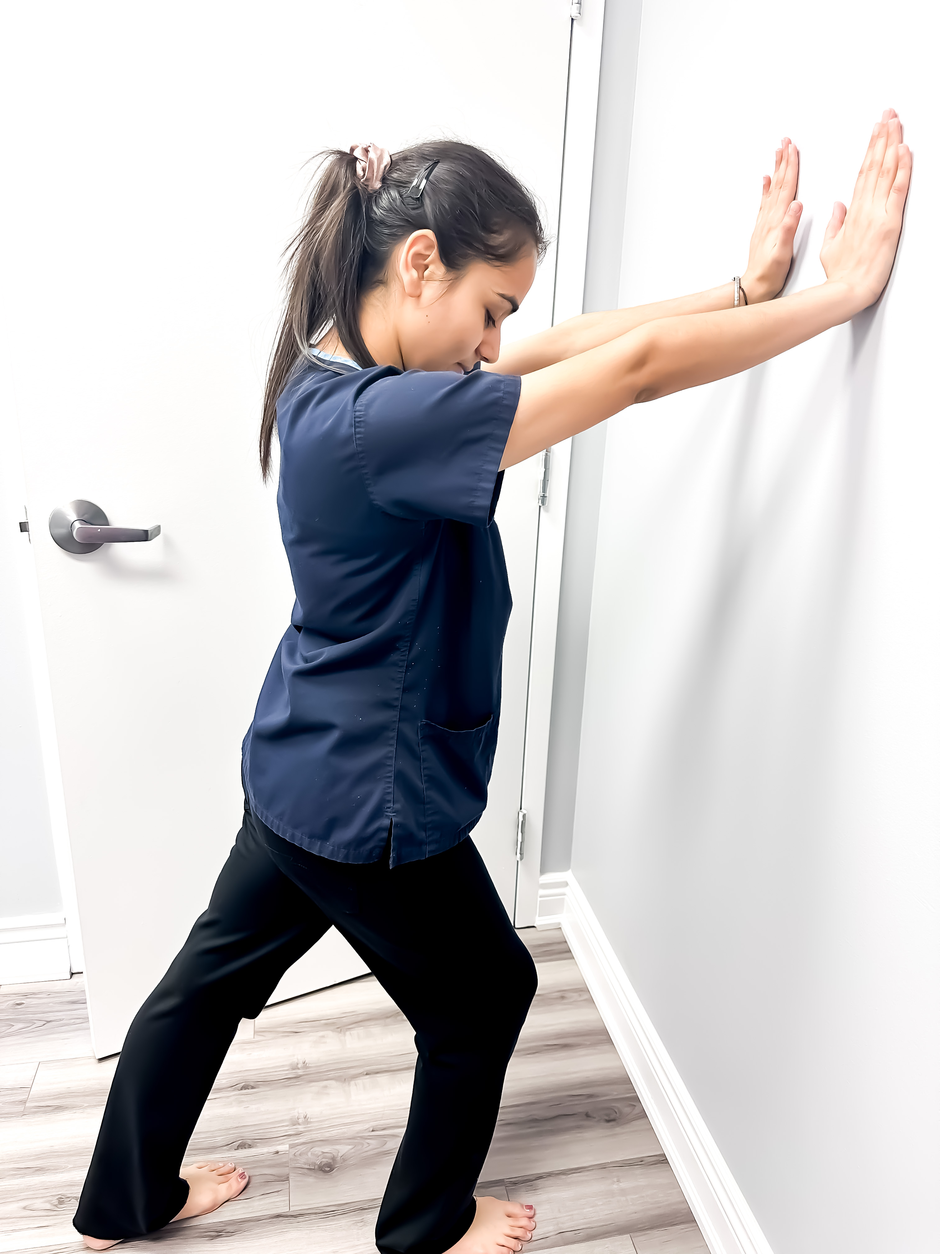 Wall stretch exercise at Circle Physiotherapy